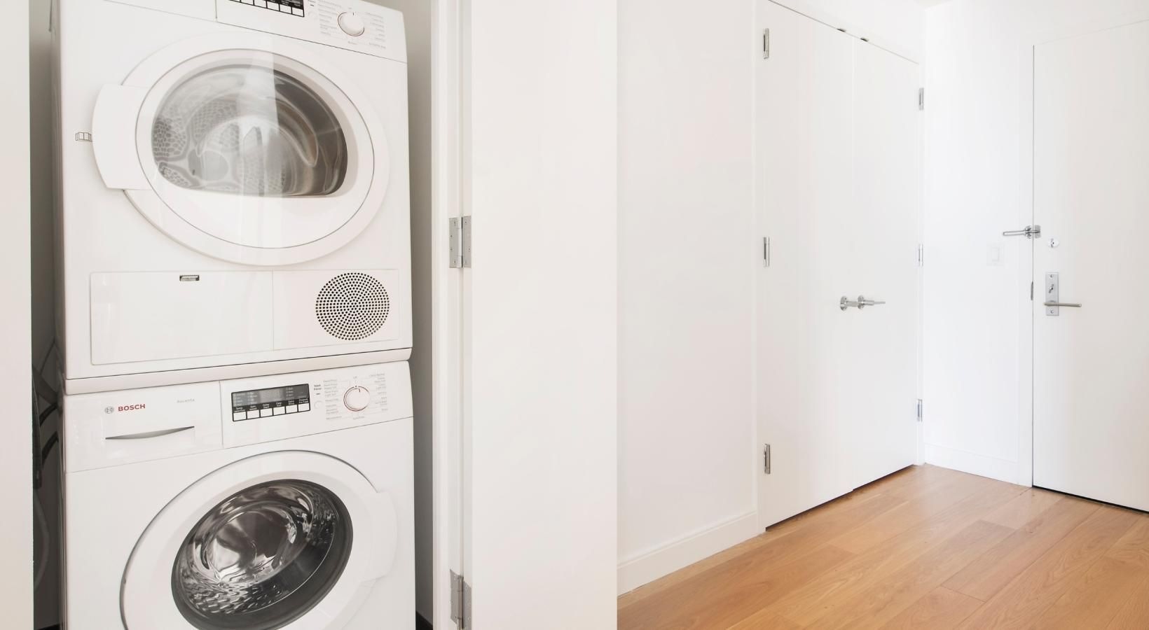 The essence of exceptional living a white laundry room with a washer and dryer
