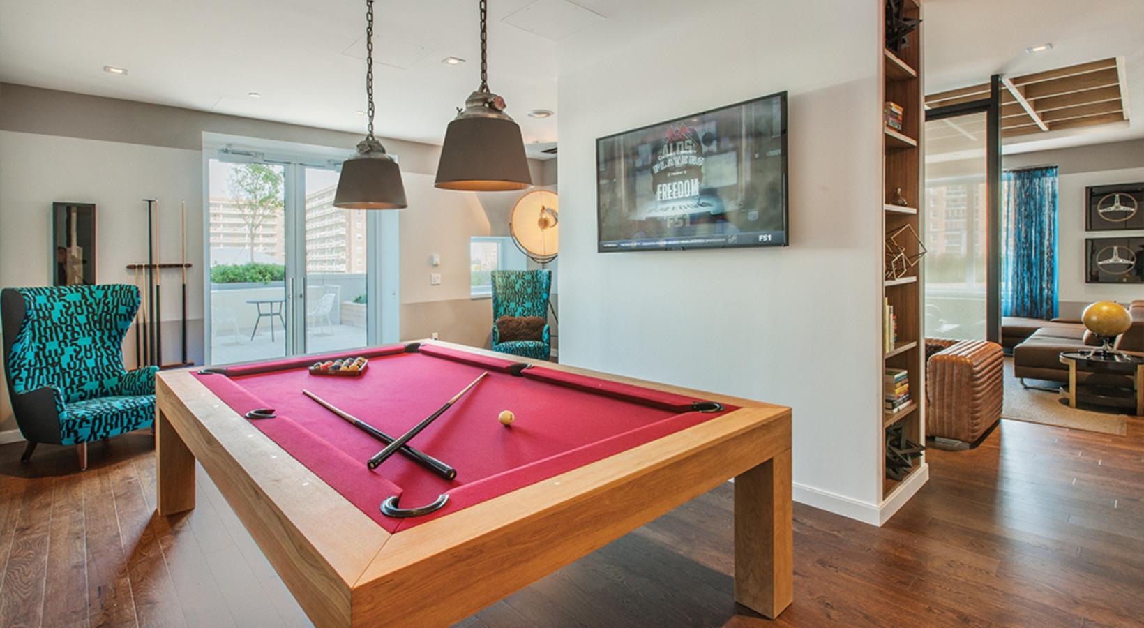 Access to resident-only features a pool table in a room