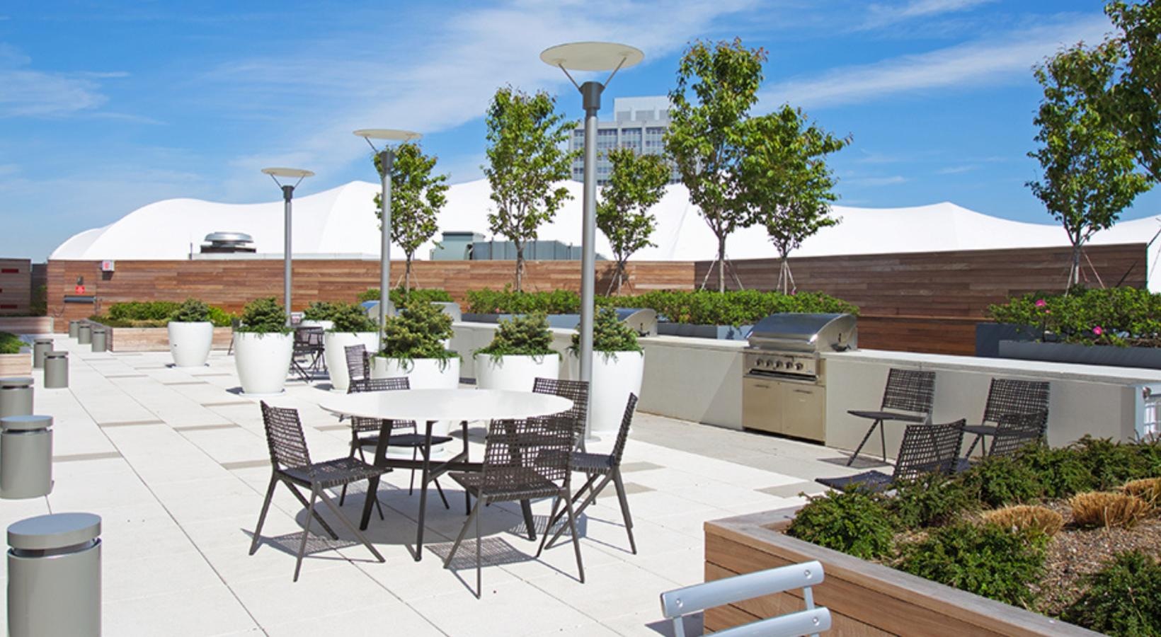 Enjoy our resident-only features a patio with a table and chairs