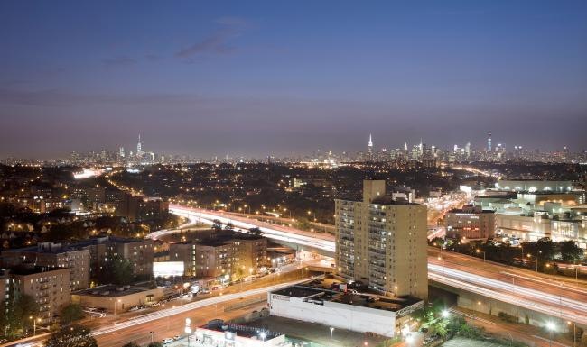 Settle into comfort at The Alexander a city with a bridge and a river