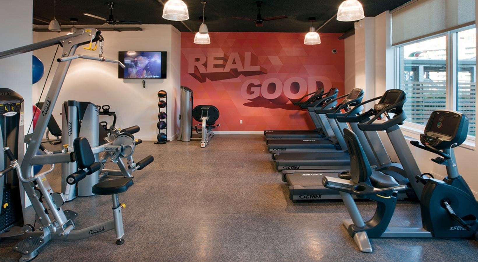 State-of-the-art amenities a gym with exercise equipment